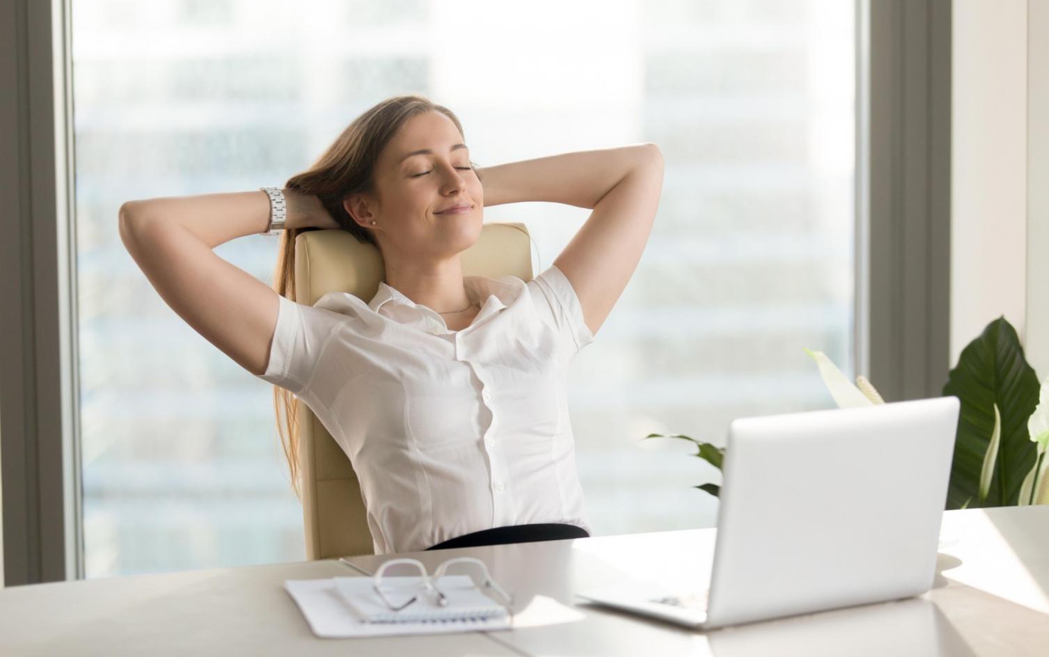 Professional reviewing content performance metrics on laptop